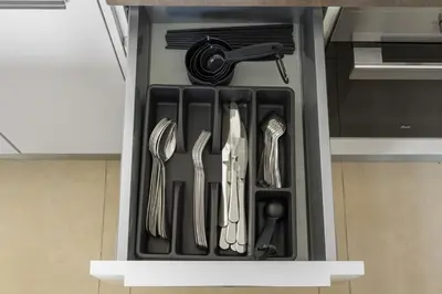 a drawer filled with utensils in a kitchen at Deluxe Marina Gate Suite with Sea and Ain Dubai View in Dubai