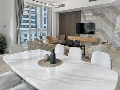 a living room with a white table and chairs at Cozy 2BR l Marina l Steps to Beach l Balcony l Pool in Dubai