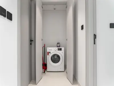 a laundry room with a washing machine in it at Breathtaking 1 BDR with Palm & Marina View-25 in Dubai