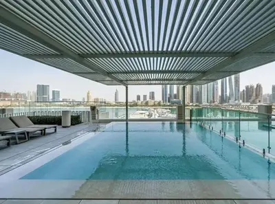a large swimming pool on the roof of a building at Breathtaking 1 BDR with Palm & Marina View-25 in Dubai