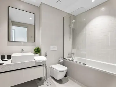 a bathroom with a toilet and a sink and a shower at Breathtaking 1 BDR with Palm & Marina View-25 in Dubai