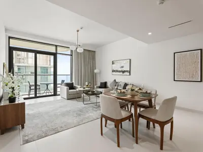 a living room with a table and chairs at Breathtaking 1 BDR with Palm & Marina View-25 in Dubai