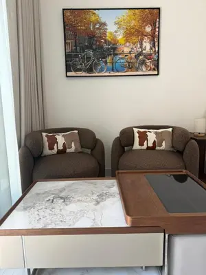 a living room with two couches and a coffee table at 4 Months Offer Brand new Modern Prime Amenities in Dubai