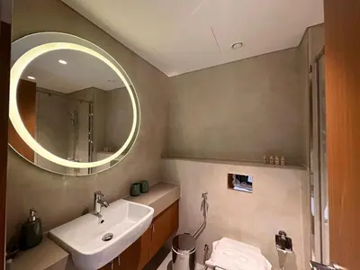 a bathroom with a sink and a mirror at 4 Months Offer Brand new Modern Prime Amenities in Dubai
