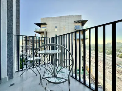 a balcony with a table and chairs on a building at 4 Months Offer Brand new Modern Prime Amenities in Dubai