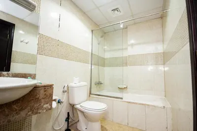 a bathroom with a toilet and a sink and a shower at Fully Furnished Studio at City Tower al Barsha Near Mall of the Emirates in Dubai