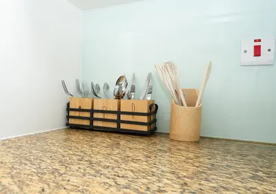 a container of utensils sitting next to a wall at Luxury Executive 1BR with Full Burj Khalifa View- Downtown in Dubai
