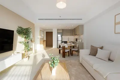 a living room with a couch and a table at Al Jazi 2, Madinat Jumeirah Living - Mint Stay in Dubai