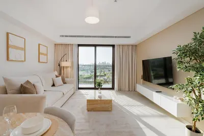 a living room with a couch and a tv at Al Jazi 2, Madinat Jumeirah Living - Mint Stay in Dubai