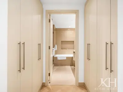 a bathroom with white cabinets and a bath tub at keylid-Stunning-Luxury 2BR connected to Dubai Mall in Dubai