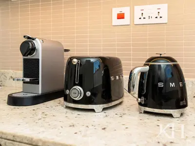 two toasters sitting on a counter next to a toaster at keylid-Stunning-Luxury 2BR connected to Dubai Mall in Dubai
