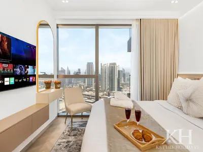 a hotel room with a view of a city at keylid-Stunning-Luxury 2BR connected to Dubai Mall in Dubai