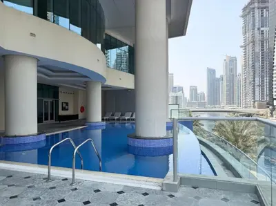 a swimming pool in a building with a view of a city at FIRST CLASS 2BR Spectacular Marina Views in Dubai