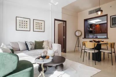 a living room with a couch and a table at Burj Khalifa View 29 Boulevard Downtown - Free Parking in Dubai