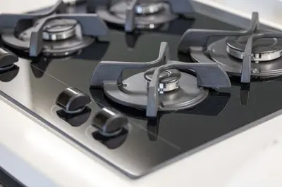 a close up of a gas stove top burner at LUX 2 BDR apartment - Burj Khalifa view in Dubai