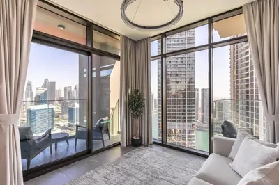 a living room with a view of a city at LUX 2 BDR apartment - Burj Khalifa view in Dubai