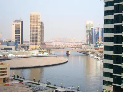 a view of a river in a city with buildings at Business Bay Luxury Apt - 5min Burj Khalifa, Mall & Metro in Dubai