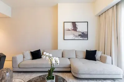 a living room with a couch and a table at Luxury 3BR Burj View in Downtown Dubai in Dubai
