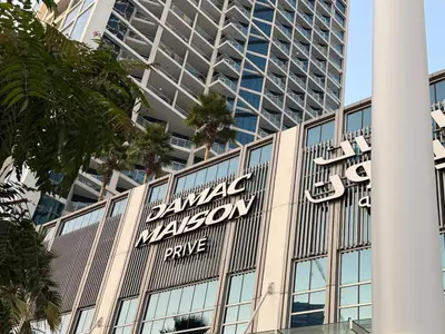 a large sign on the side of a building at Studio with Pool & Canal Views - Near Dubai Mall - Downtown in Dubai
