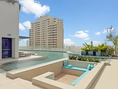 a swimming pool on the roof of a building at VayK - Luxury Living with Top Amenities 1BD in JVC in Dubai
