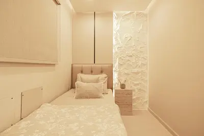 a small bedroom with a bed and a window at Elegantly crafted 5 Bedroom with Marina View in Dubai