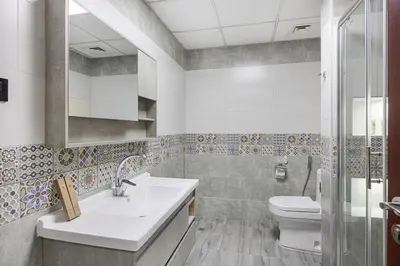 a bathroom with a sink and a toilet at FiveX Premium 4BR Beachfront Living at JBR in Dubai