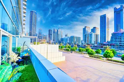 a balcony with a view of a city skyline at Barsana - Jumeirah Beach Villa - 2BDR - Marina Views in Dubai