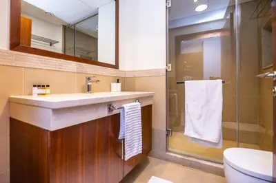 a bathroom with a sink and a shower at Luxury 3 BR Premium Feel Iconic Burj View Connected To Dubai Mall in Dubai
