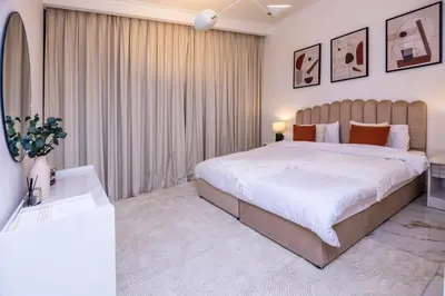 a bedroom with a large bed in a room at Luxury 3 BR Premium Feel Iconic Burj View Connected To Dubai Mall in Dubai