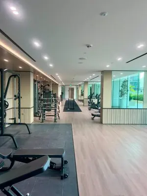 a gym with a lot of treadmills and exercise equipment at Stylish Dubai Stay, Pool, Padel, Gym, Concierge in Dubai