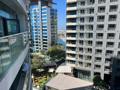 an aerial view of a large apartment building at Cozy Studio with Private Beach in Dubai
