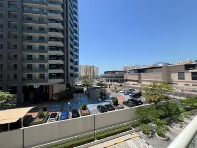 a view of a parking lot with cars in a parking lot at Beach access, next to shopping mall in Dubai