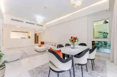 a dining room with a table and chairs at Luxury Apartment in Palm Jumeirah, Breathtaking Sea Views in Dubai