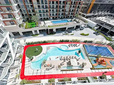 an overhead view of a swimming pool in a building at Stylish Contemporary Studio in Oxford Gardens in Dubai