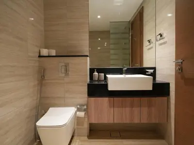 a bathroom with a white sink and a toilet at Urban Oasis by Missoni in Dubai