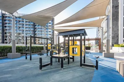 a playground on the roof of a building at Elegant 1BR Near Downtown Azizi Riviera 3 in Dubai