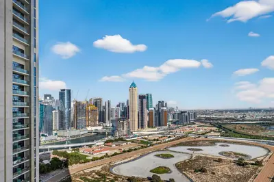 a view of a large city with tall buildings at Dubai Business Bay Modern Cozy Studio with Skyline Views & Lagoon Pool Access in Dubai
