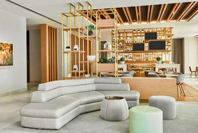 a living room with a couch and a table at Hilton Garden Inn Dubai, Mall Avenue in Dubai