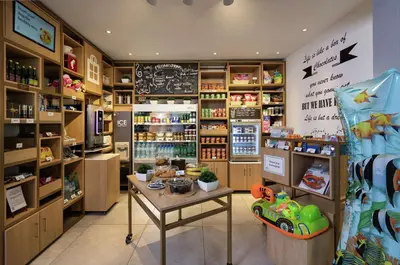 a grocery store with a table in a room at Hilton Garden Inn Dubai, Mall Avenue in Dubai