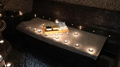a table with candles and lights on it at Signature 1 Hotel Tecom in Dubai