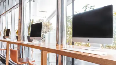 a computer monitor sitting on top of a desk at Signature 1 Hotel Tecom in Dubai