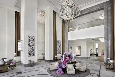a rendering of a lobby with a chandelier at Kempinski The Boulevard Dubai in Dubai