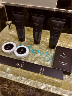 a display of three products on a table at Smana Hotel Al Raffa in Dubai