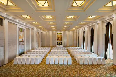 a large room with rows of white chairs in it at Shangri-La Dubai in Dubai