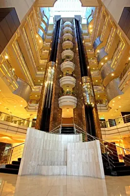 a large building with a spiral staircase in a mall at Sea View Hotel Dubai in Dubai
