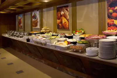 a buffet line with many different types of food at Capitol Hotel Jumeirah Dubai in Dubai