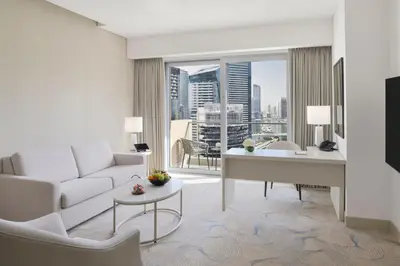a living room with a white couch and a table at JW Marriott Hotel Marina in Dubai