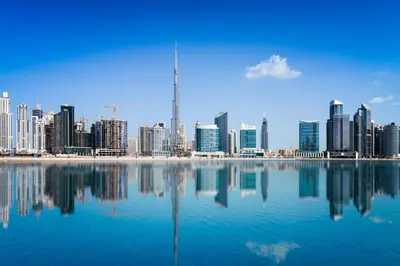 a view of a city skyline from a body of water at Naumi Hotel Dubai in Dubai
