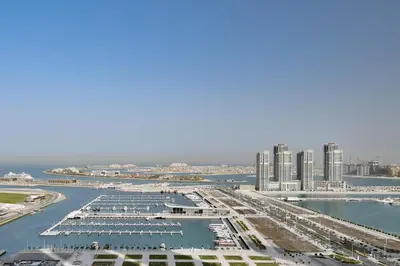 an aerial view of a marina with tall buildings at Dubai Marriott Harbour Hotel And Suites in Dubai