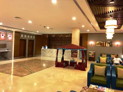 a lobby with a gazebo in the middle of a building at Fortune Park Hotel in Dubai